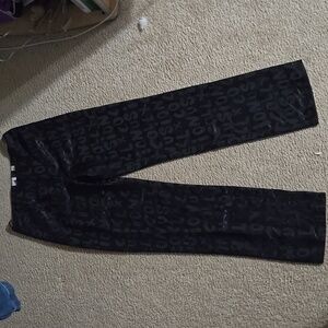 Black silk pants with letters on it